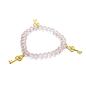 Pulsera Cristal Rosa Con Dije De Tres Llaves